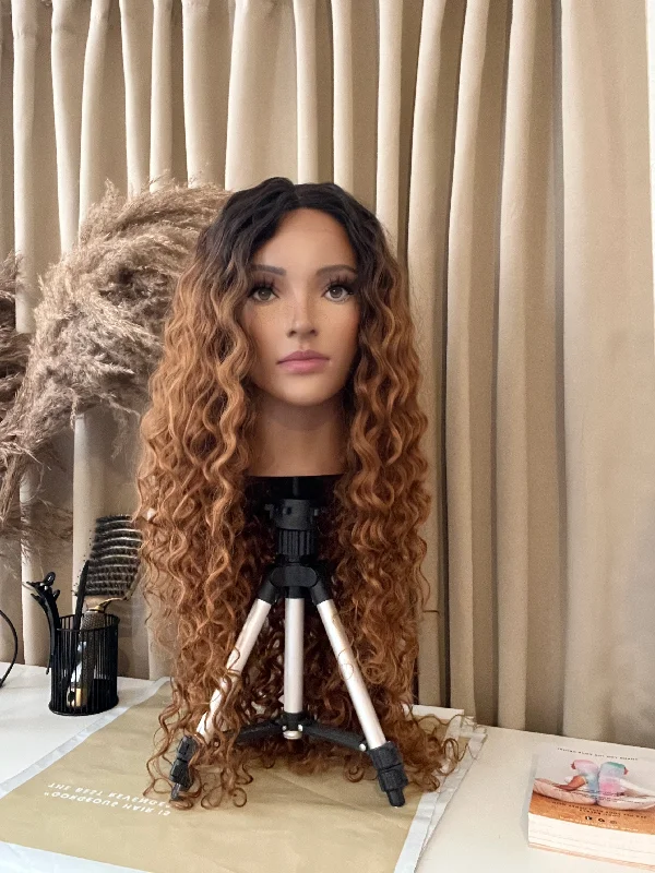 Lace wig with a natural - looking root for a more realistic lookSaskia 28” Curly Brown Synthetic Lace Wig Lace wig with a natural - looking root for a more realistic lookSaskia 28” Curly Brown Synthetic Lace Wig